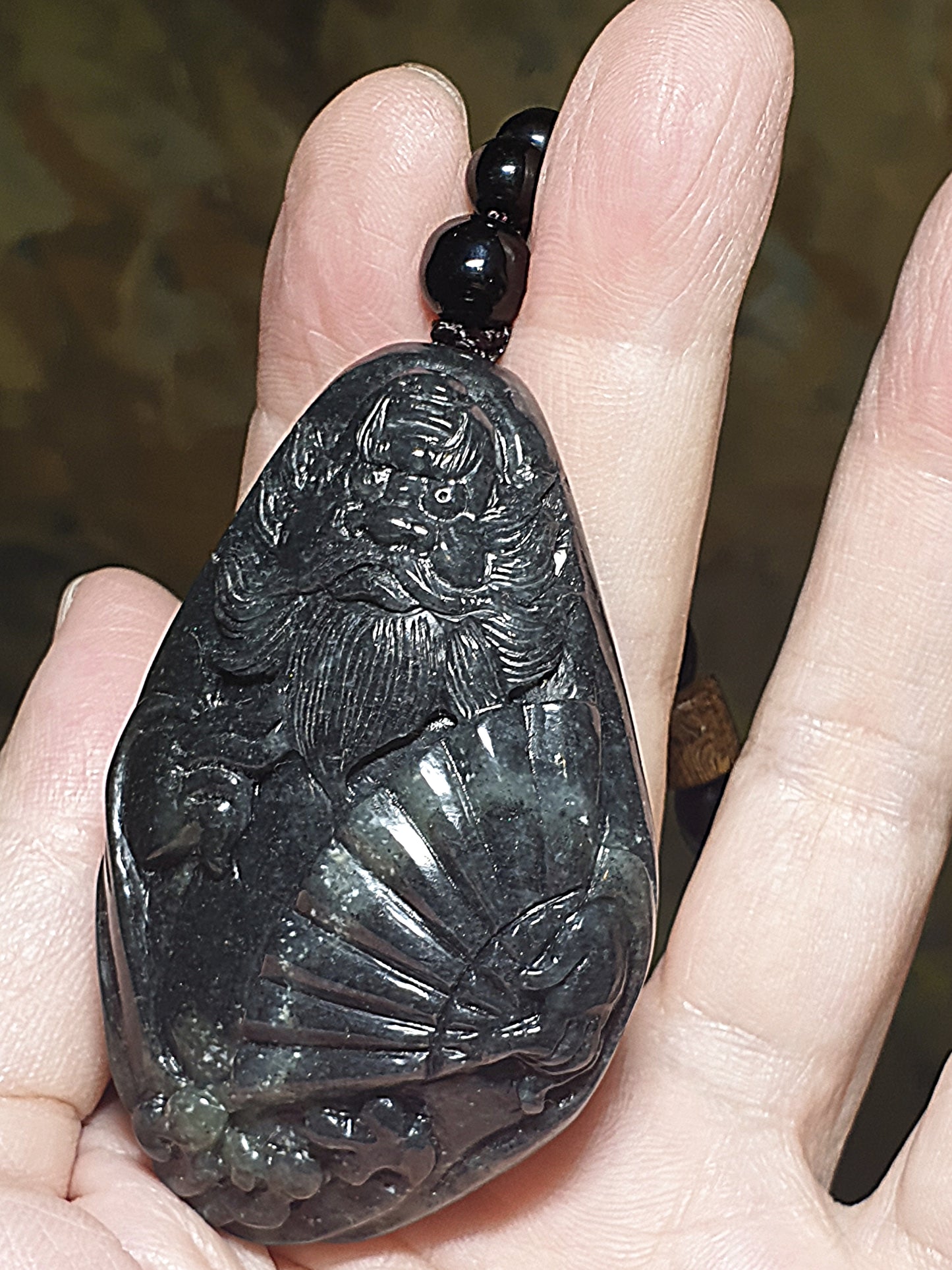 Premium Pebble Nephrite Qinghua ink black hand carved Zhong Kui palmstone (with certificate) 和田玉青花籽玉聚墨如黑全手工雕刻钟馗手把(带证书)