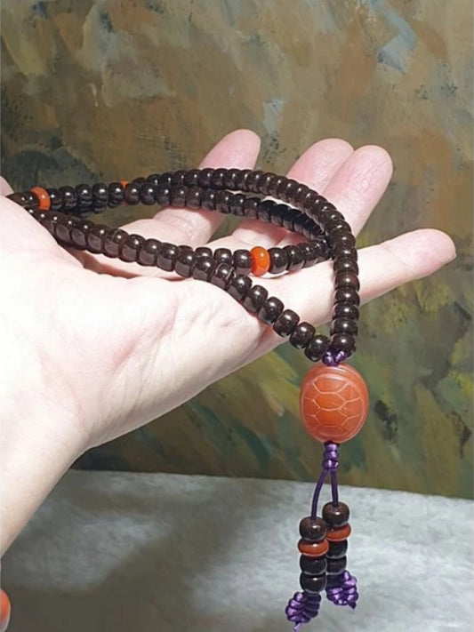 7.1mm Coconut Pedicel hand carved traditional old style beads 108 mala with Jiukou Nan Hong  spacers and a aged Baoshan Nan Hong carved Tortoise Shell [All natural] 7.1毫米椰蒂老型珠108念珠配九口南红玛瑙隔片老矿保山南红玛瑙富甲天下(雕刻龟甲)