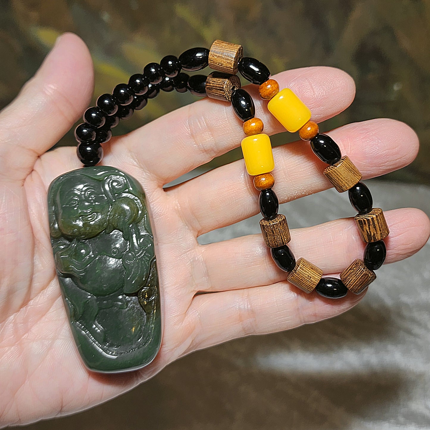 67 grams Premium Nephrite green with caramel brown Laughing Buddha Jade handheld/large pendant (with certificate) 67克优质且末和田玉绿带糖笑佛弥勒佛手把/大吊坠(带证书)