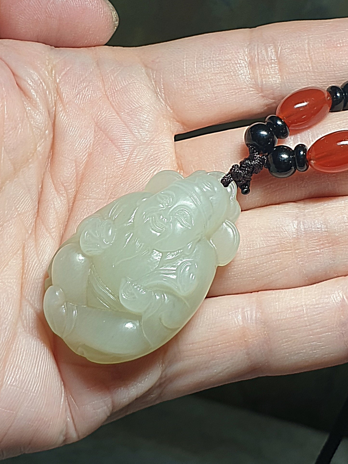 Light greenish light yellowish Nephrite with lucky "Water Wave" lines and a hint of purplish carved God of Wealth Ruyi Ingot Jade pendant (with certificate) 和田玉元宝如意财神吊坠淡黄淡绿带发财水线少许淡紫(带证书)