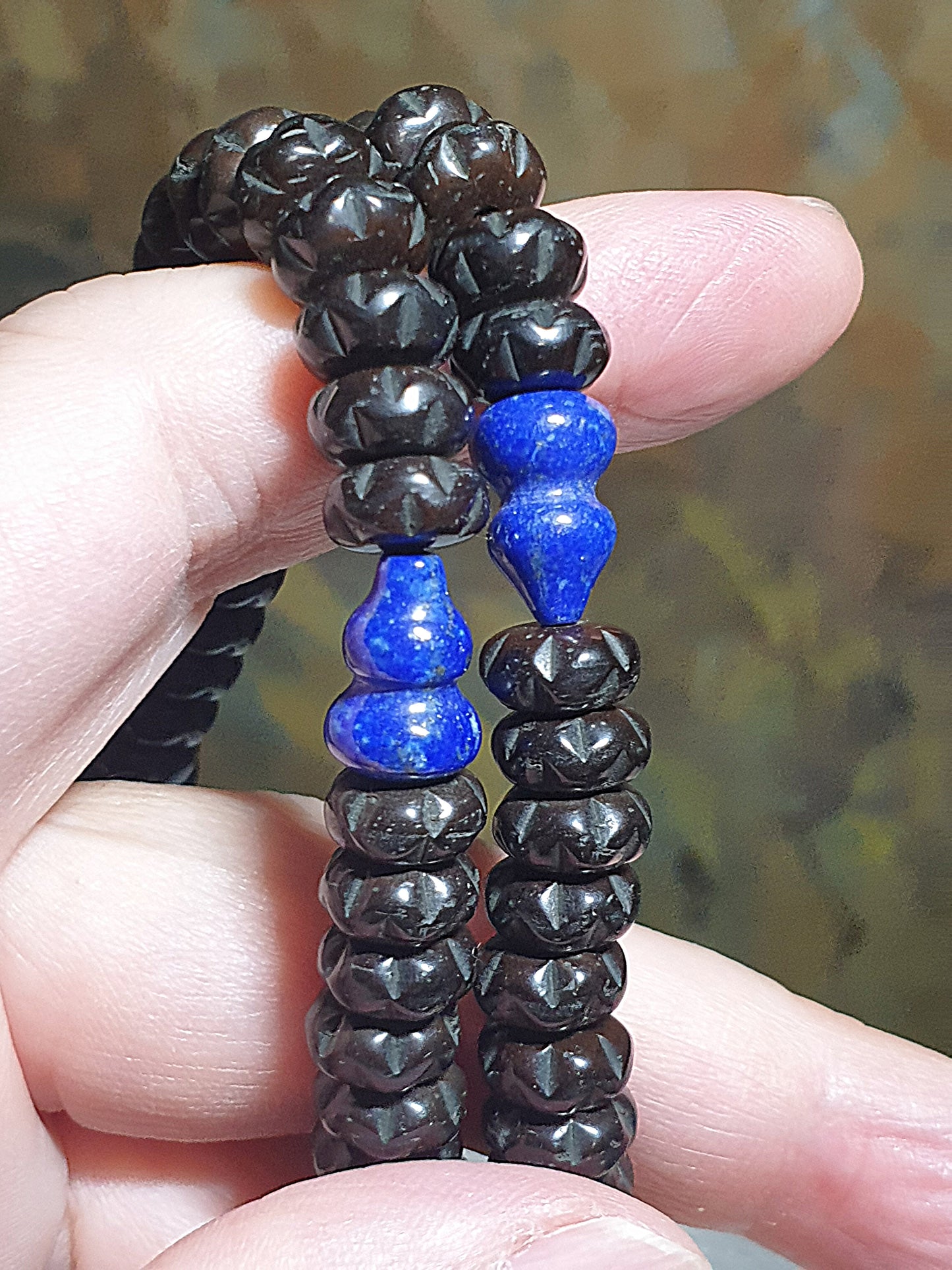 9mm Coconut Pedicel carved Bai Xiang Zi 108 mala necklace with a 10.3mm aged Baoshan Nan Hong carved Bai Xiang Zi, natural untreated Lapis lazuli Hulu and Tibetan Hulu guru bead 9毫米椰蒂雕刻百(柏)香子108念珠项链配10.3毫米老矿保山南红百香籽、原矿青金石葫芦、藏式佛头及7毫米保山南红